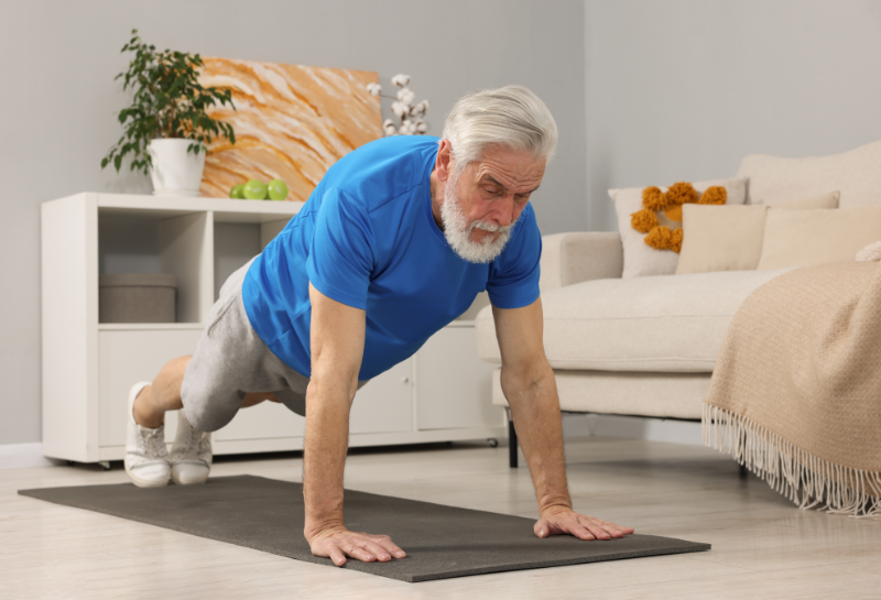 elderly man doing push ups to fight aging muscle loss