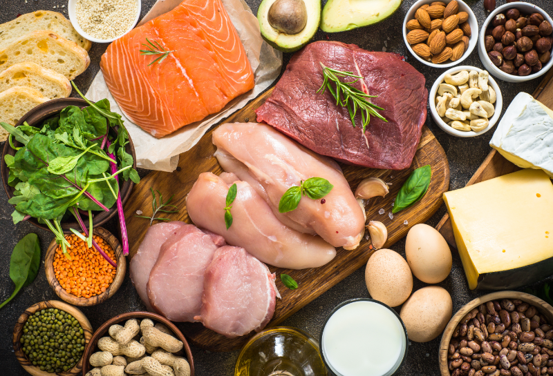 Protein-rich foods such as salmon, chicken breast, beef, eggs, lentils, and nuts to help prevent muscle loss after 50.
